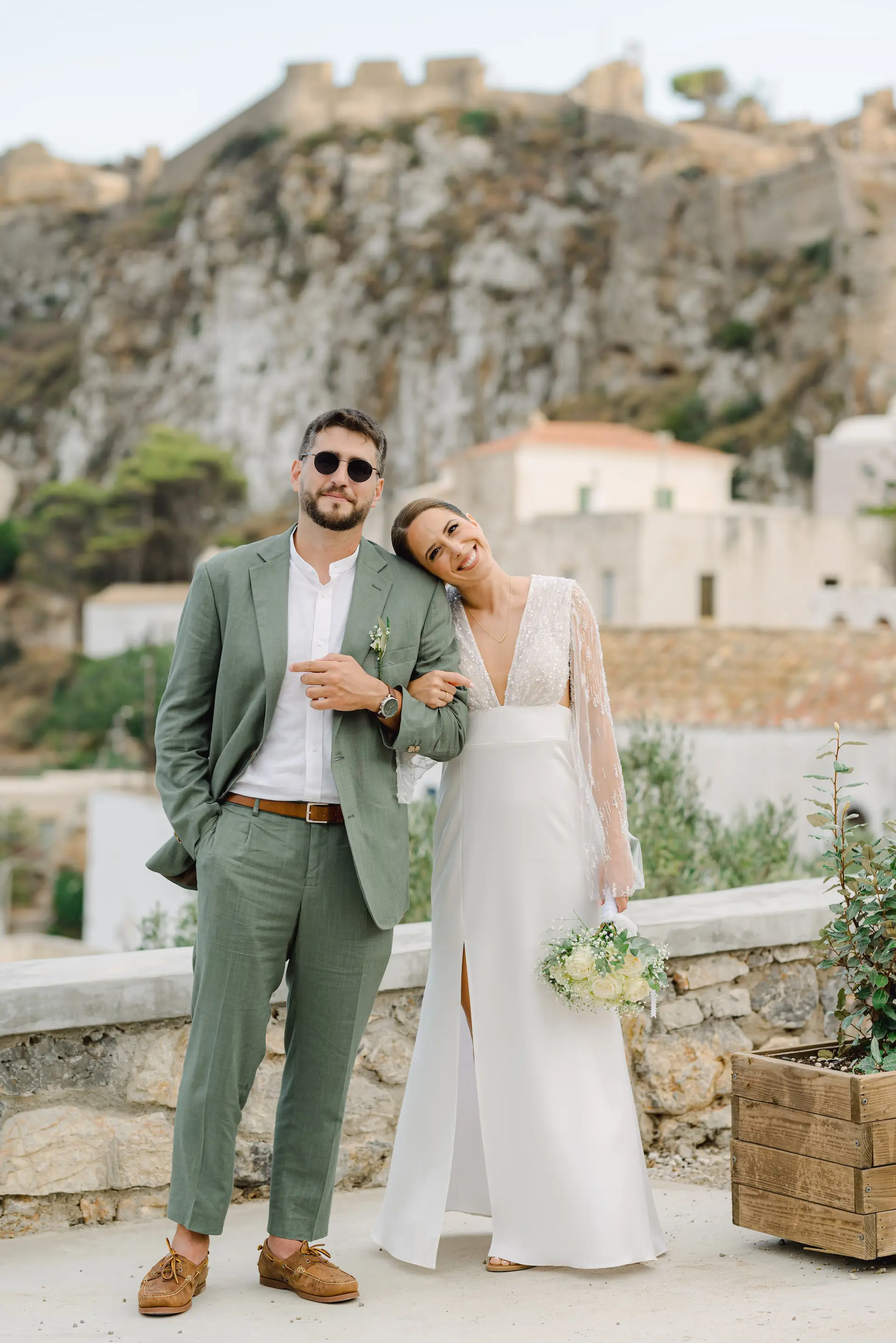 Romantic couple portrait with the historic Kythira Castle as a scenic background.