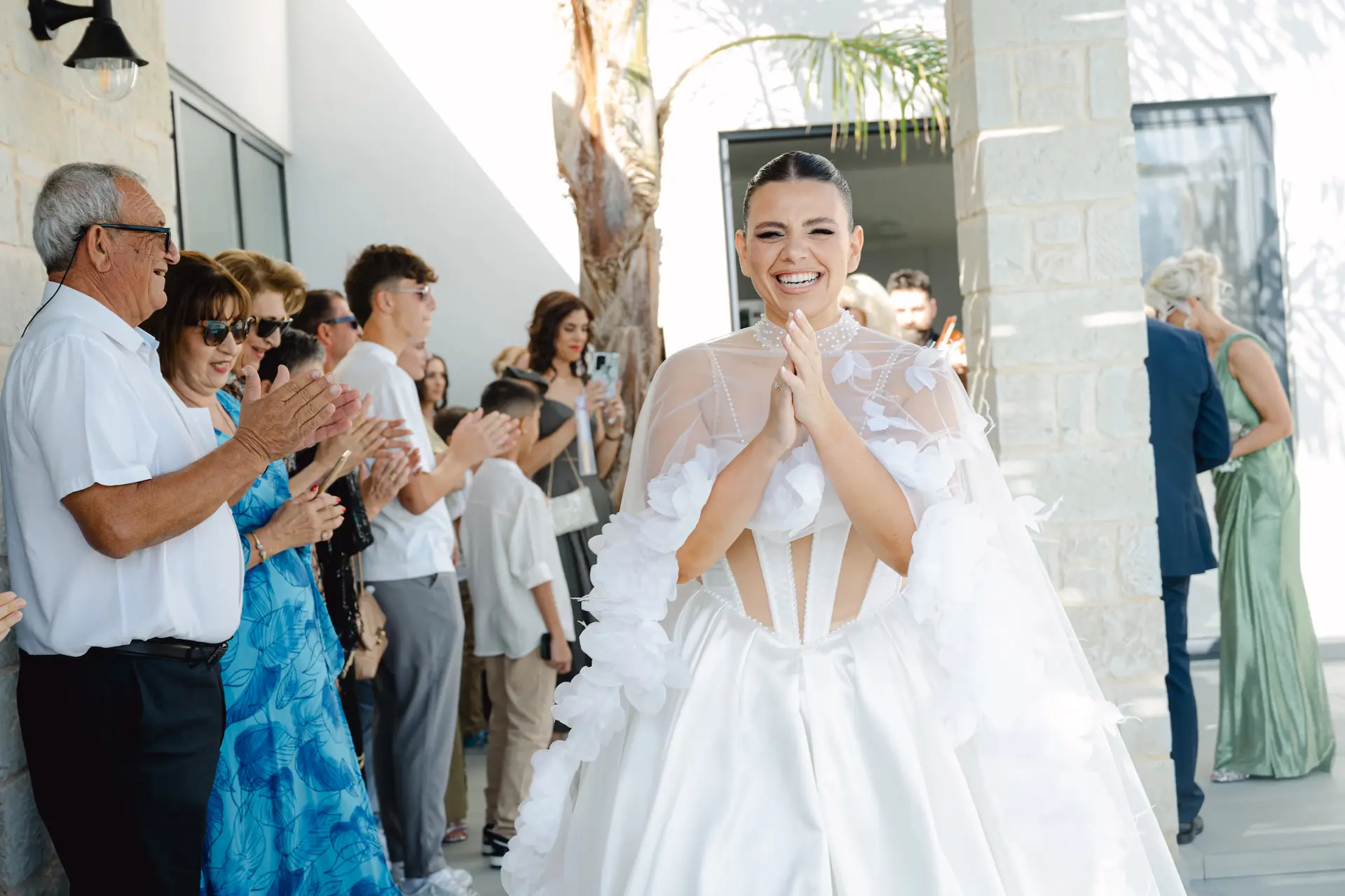 Emotional meeting between the bride, her family, and her bridesmaids, capturing a heartfelt moment of joy.