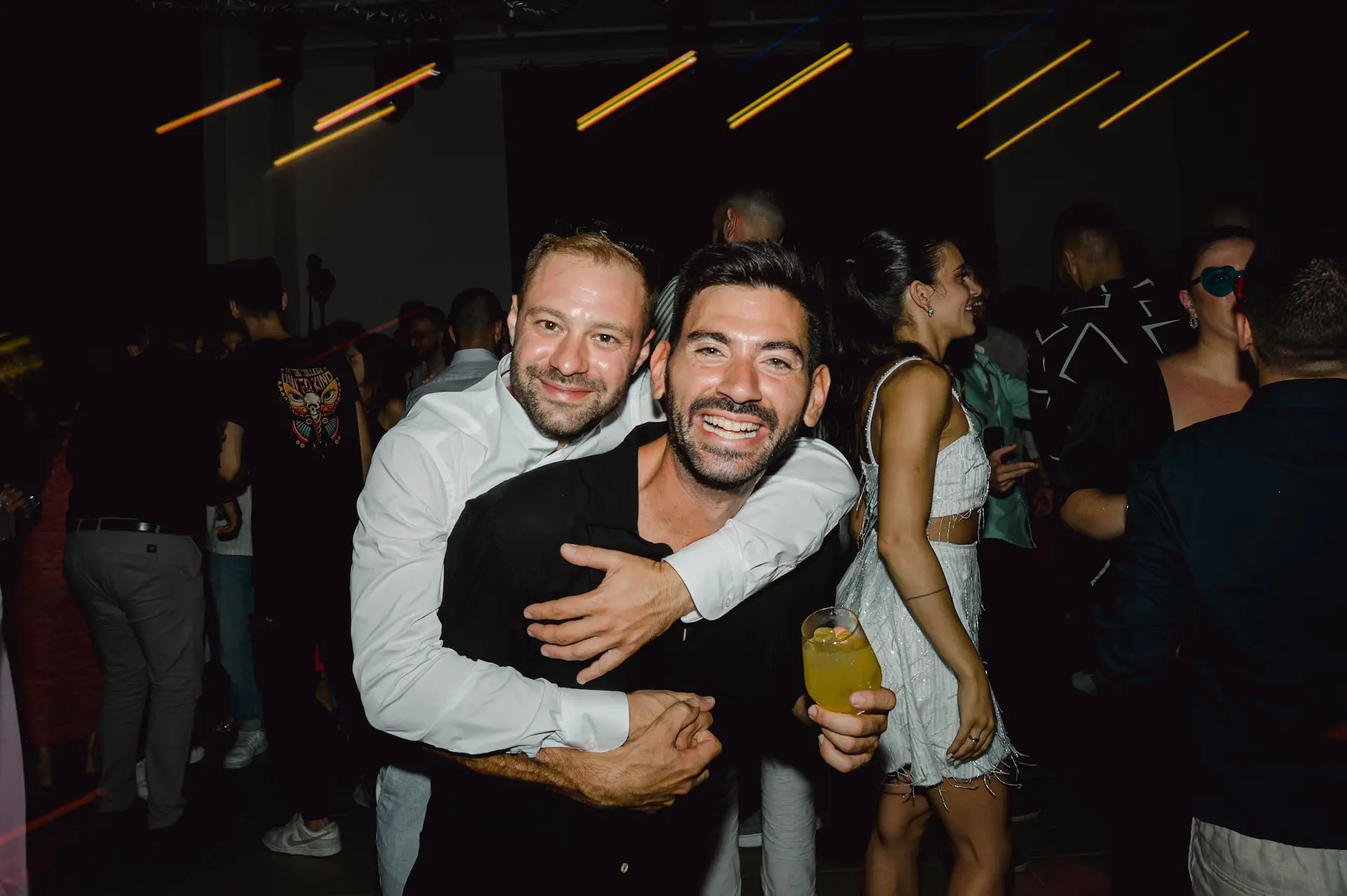 two men hugging each other
