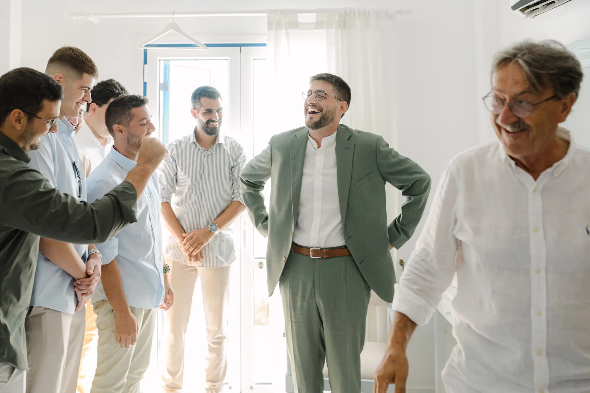 candid moment of groom and his friends during his preparation