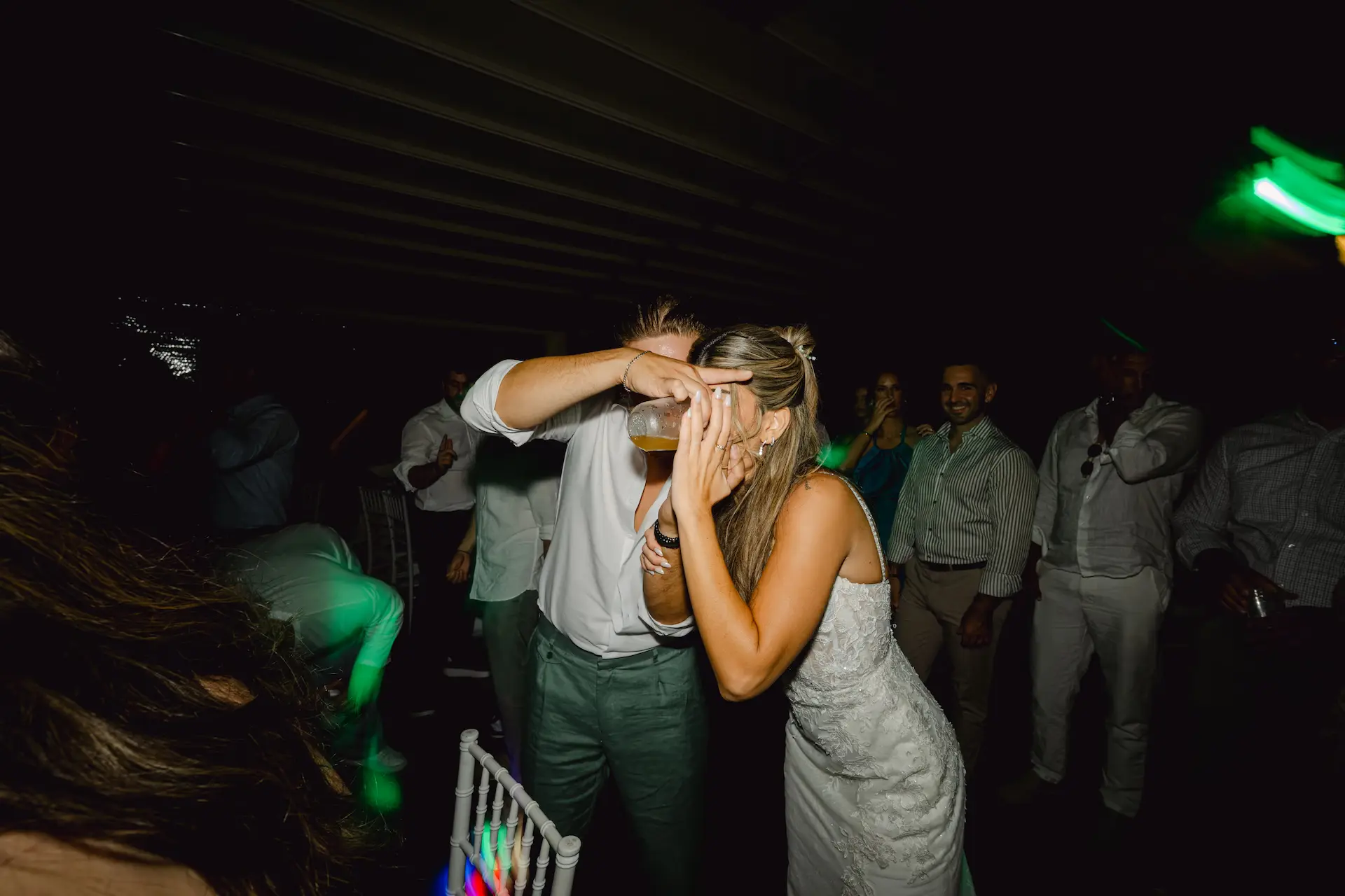 bride drinking at the wedding party