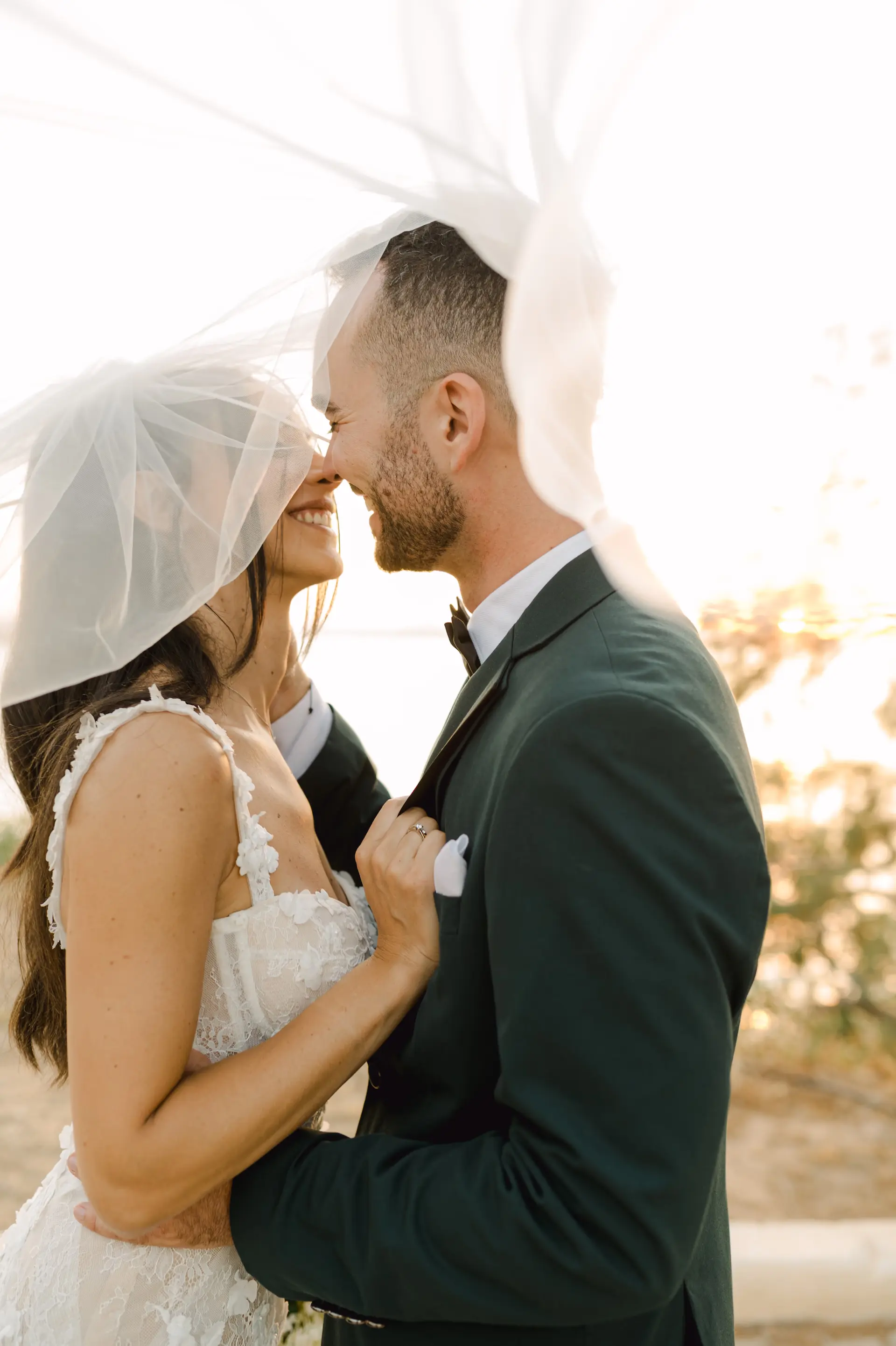 artistic portrait of bride and groom during sunset