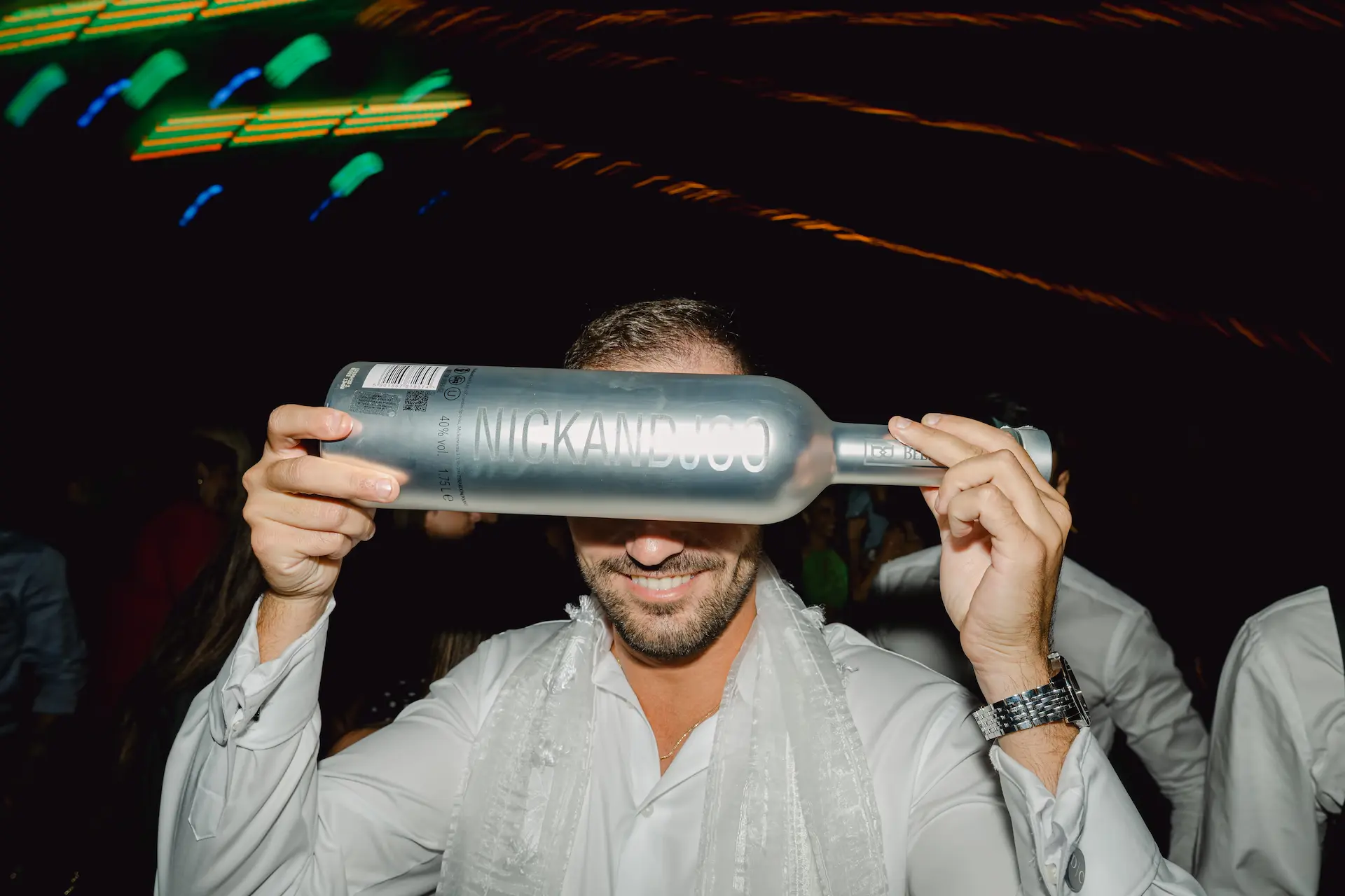 bestman cover his eyes with a custom made belvedere vodka