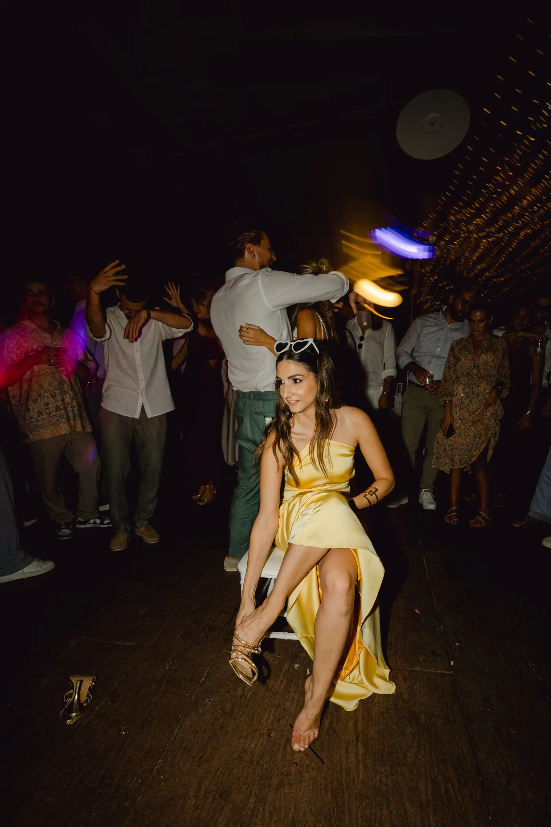 a woman in a dress and a crowd of people