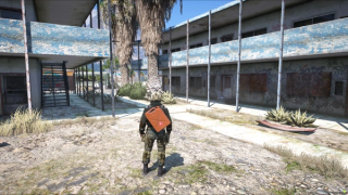 A jerry can riding on the back exactly where it was placed, seen the way everyone nearby sees it