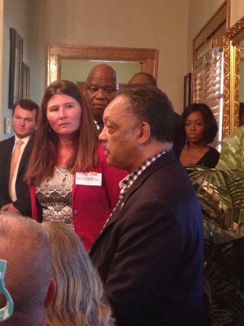 Oklahomans crowd around a visiting speaker in a packed room during the 2016 budget crisis.
