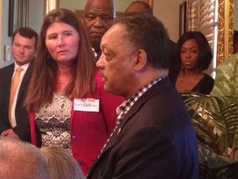 Oklahomans crowd around a visiting speaker in a packed room during the 2016 budget crisis.