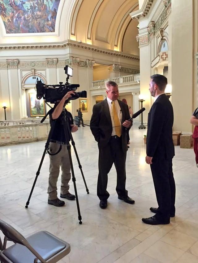 A TV camera records an interview in the Oklahoma Capitol rotunda.