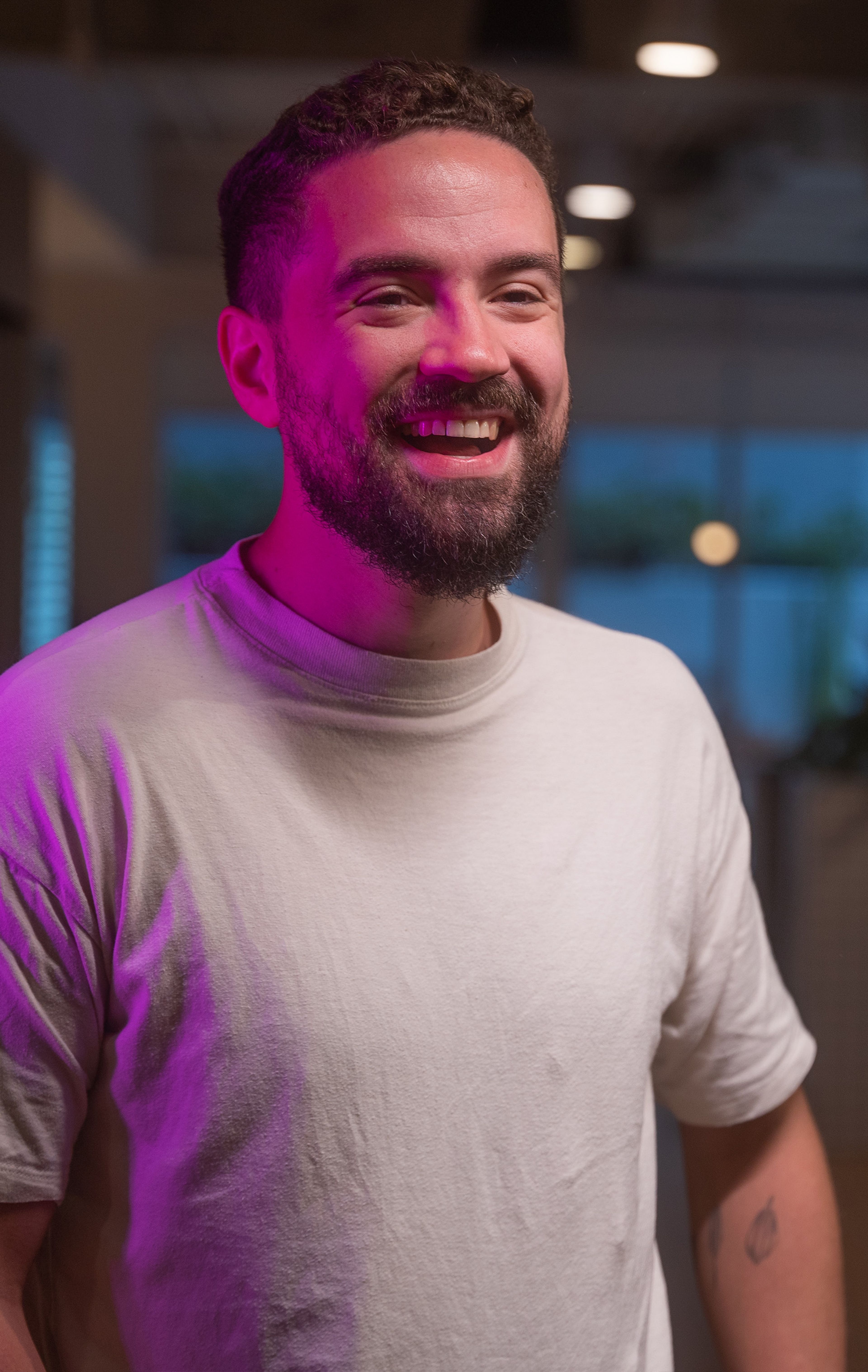  A young male ByteDance employee with a beard smiling.