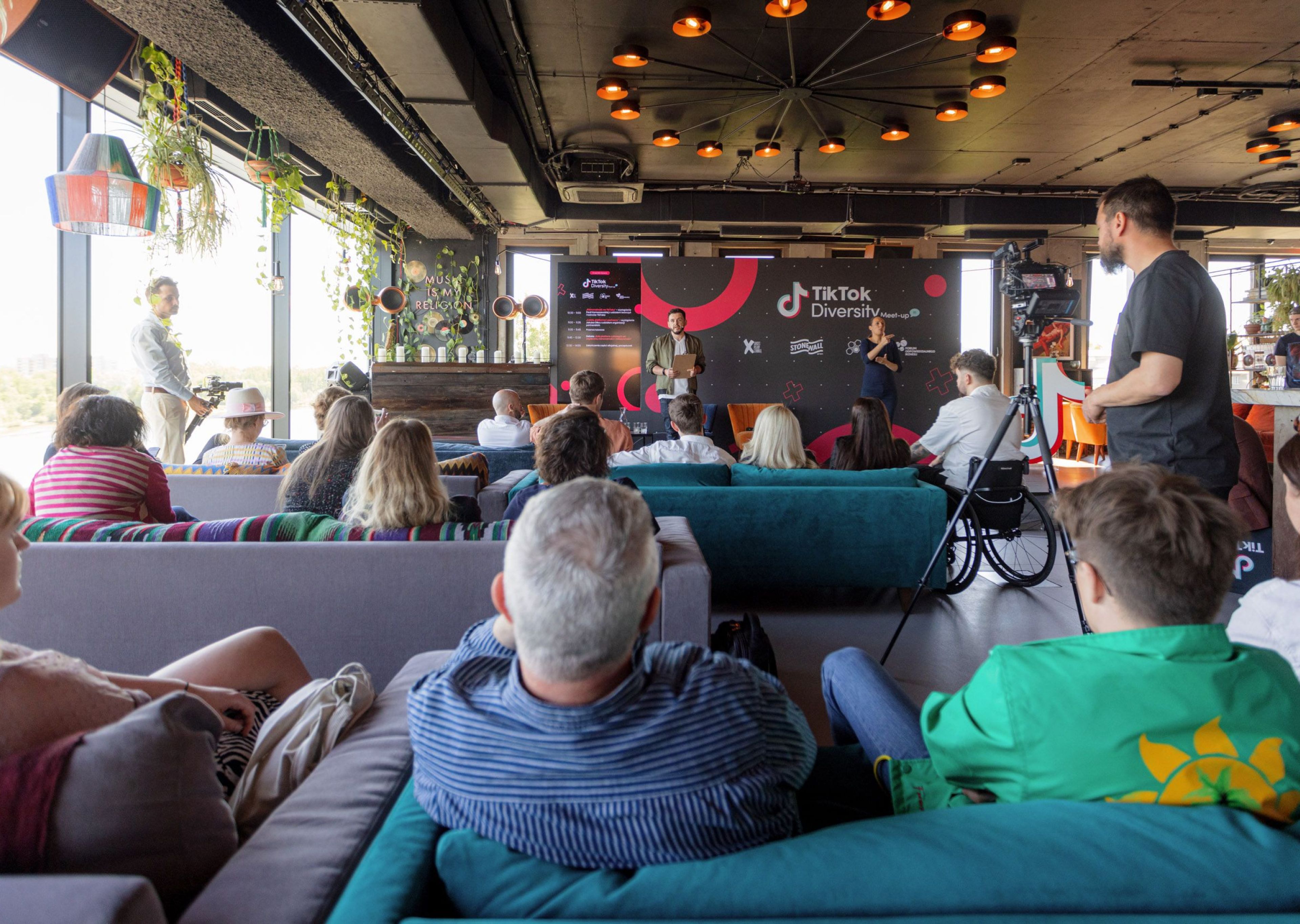 An audience of TikTok employees listen to a talk on diversity.