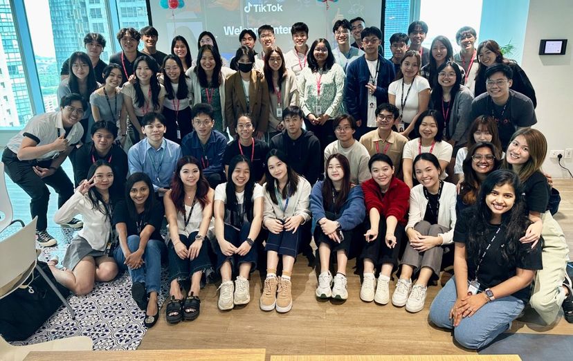 A group of TikTok Summer Interns pose excitedly for a group photo.