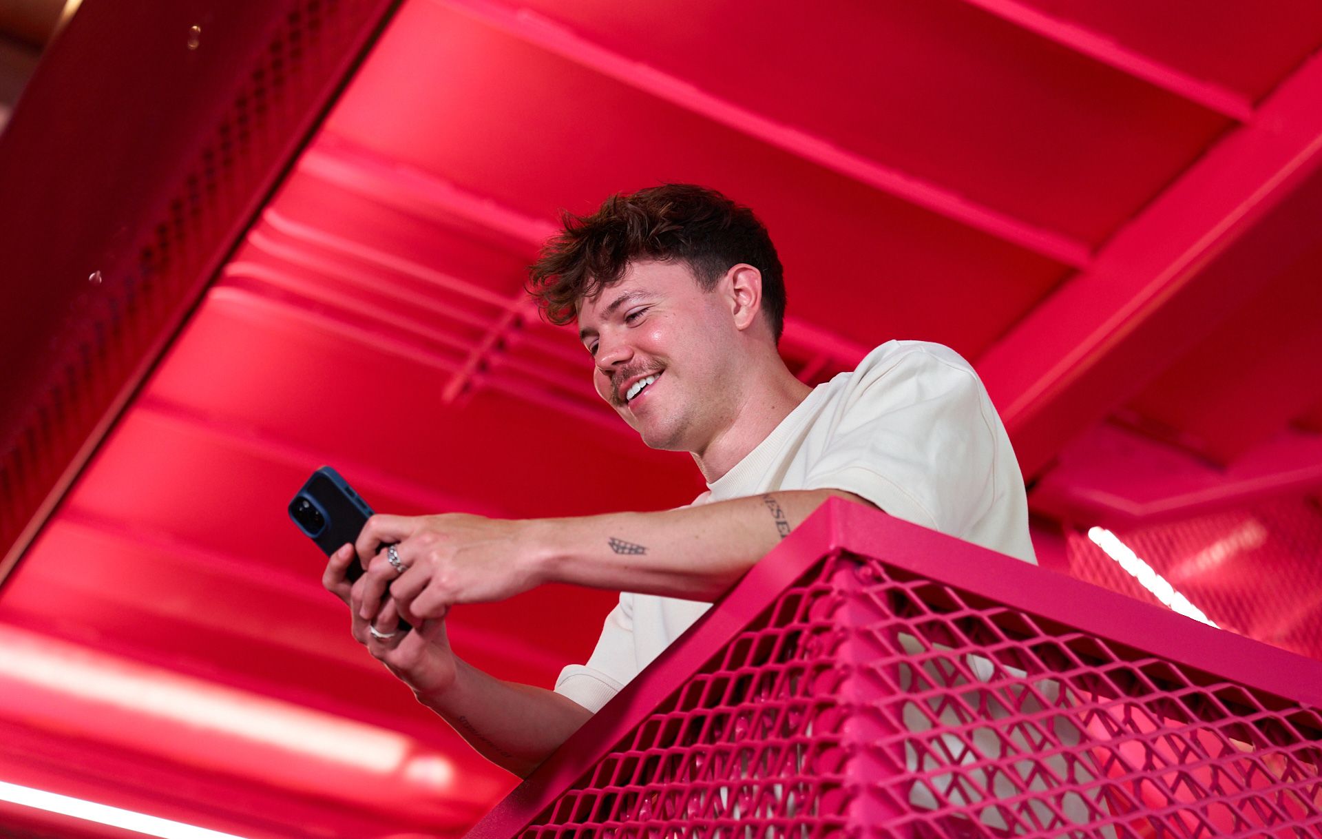  A male attendee of the ByteDance E-commerce program looks at his phone.