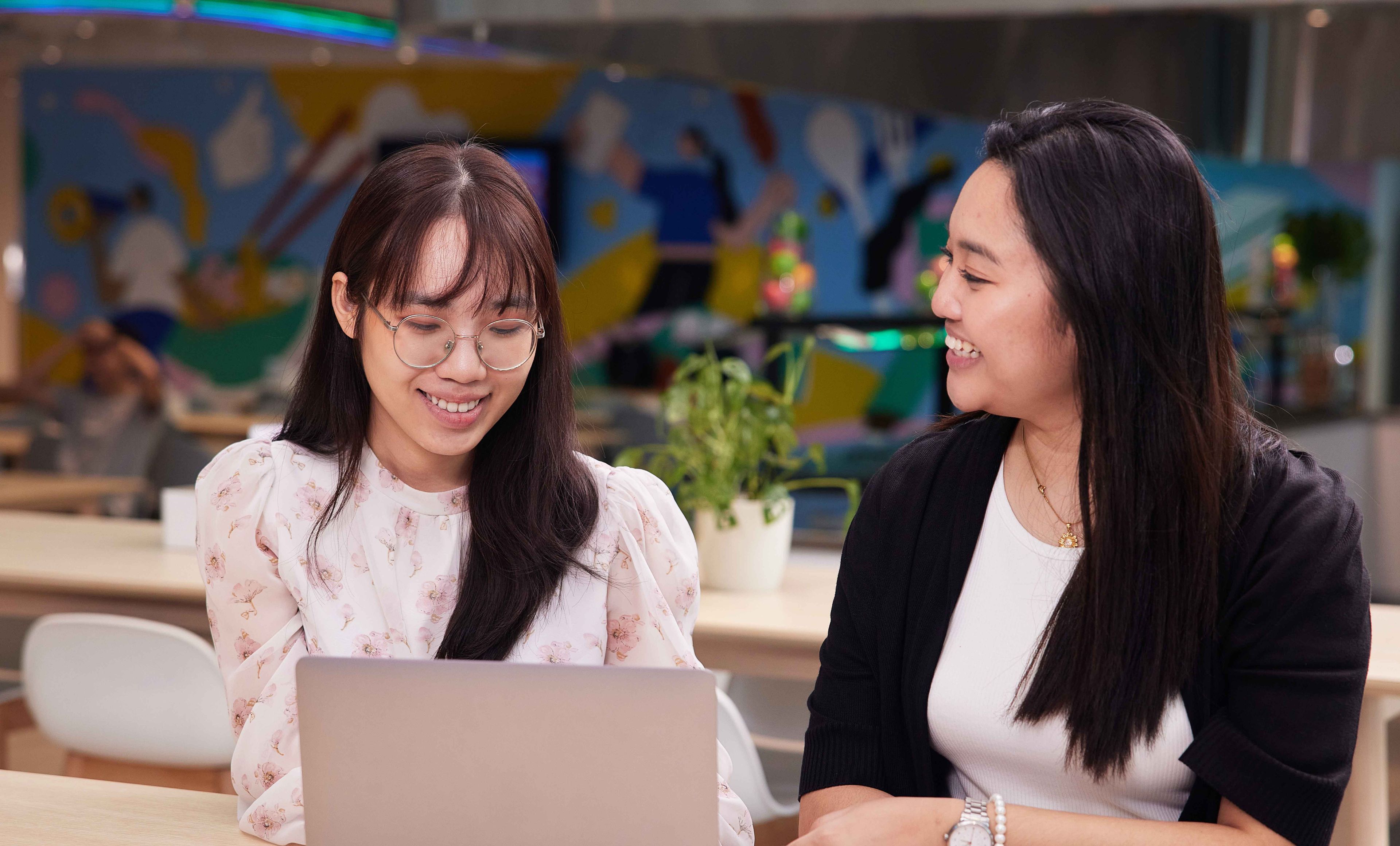 E-commerce graduate students smiling and talking