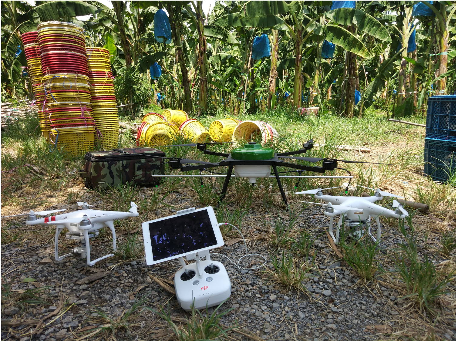 Figure 4: Instruments for the data acquisition (DJI Drones), and insitu fertilizer spraying (Custom made green color drone) enabled VPU using Movidius Neural Stick (Fig 5).