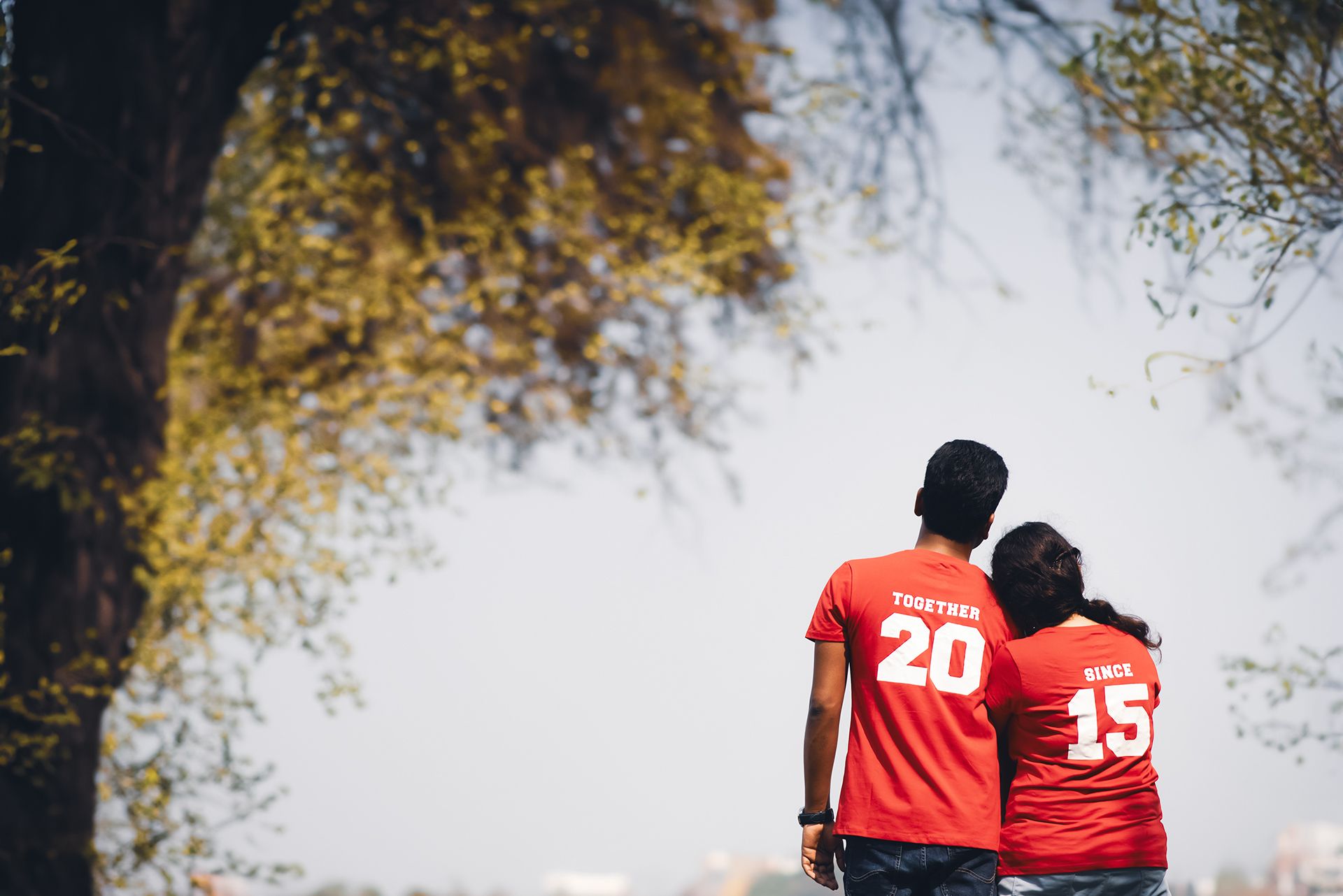 Couple Matching Red T-Shirt Pre Wedding Photoshoot in Nature | The Vedic Wedding