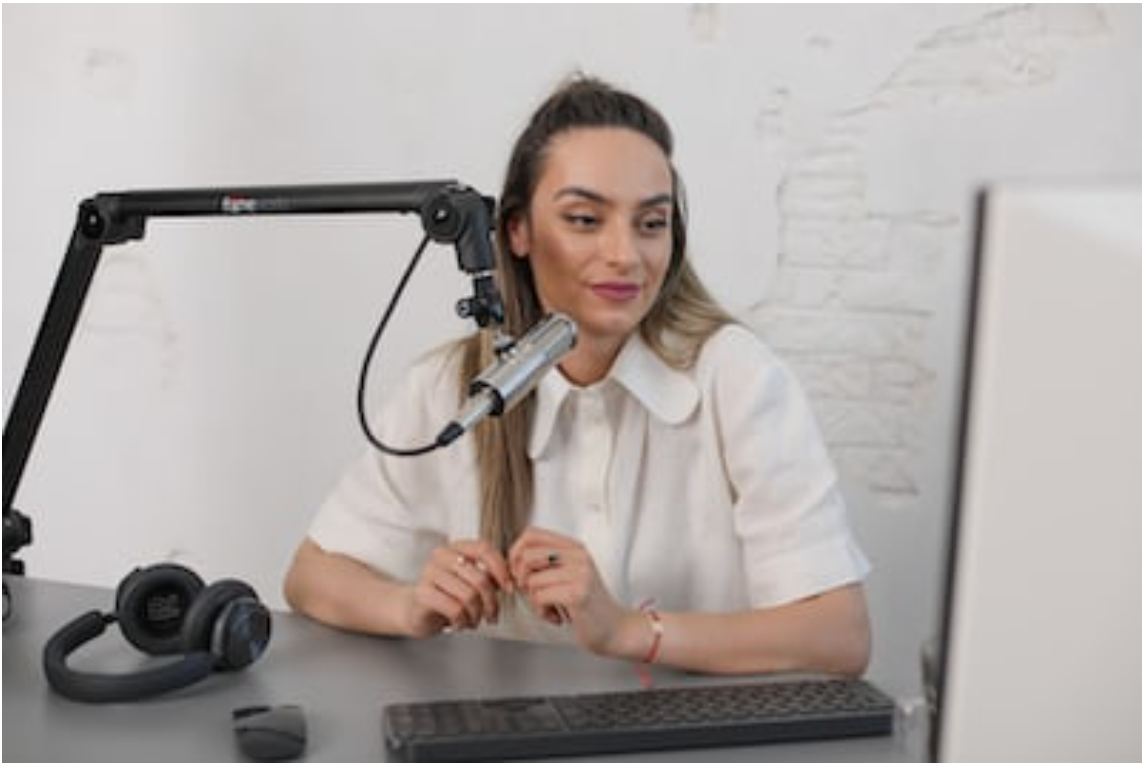 Woman recording a YouTube video in her studio