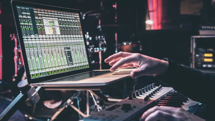 music producer setting parameters in a laptop