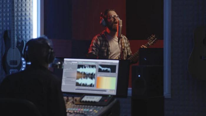 musician singing at home studio