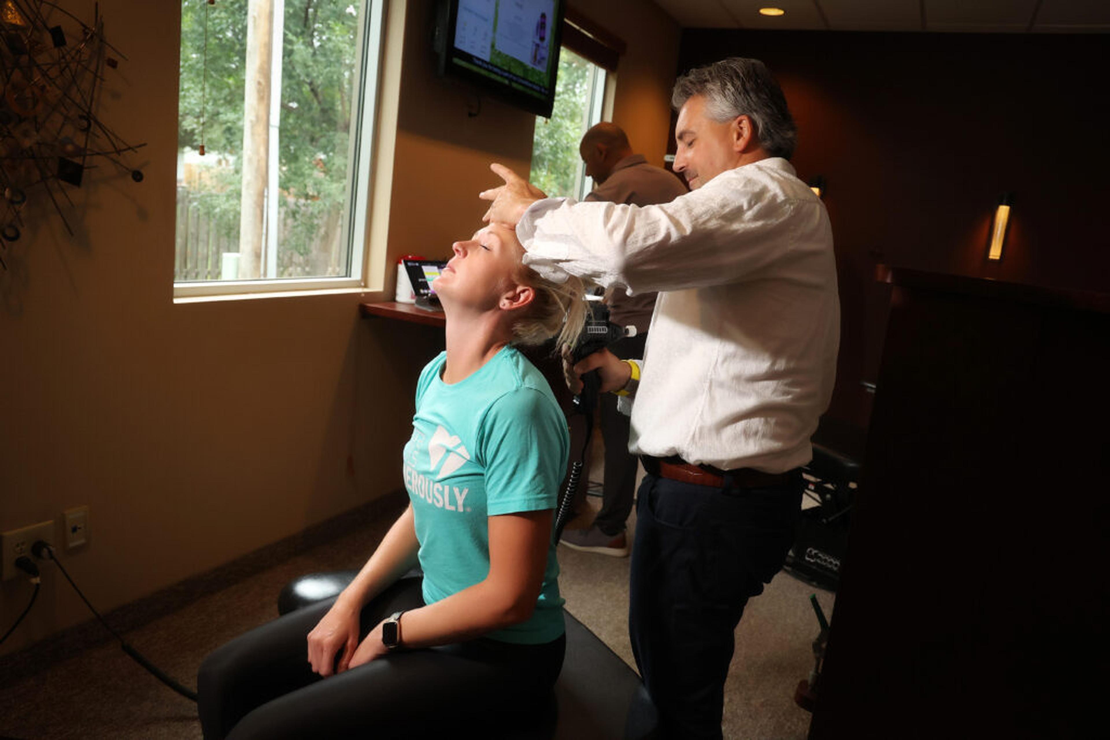 Dr. Matt Hanson performing chiropractic adjustment at CornerStone Chiropractic in Minot, ND