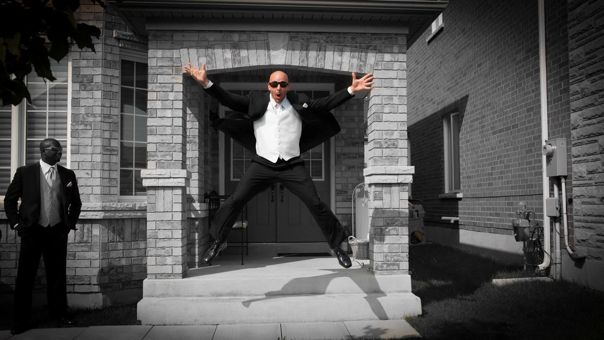 Groom Jumping for joy