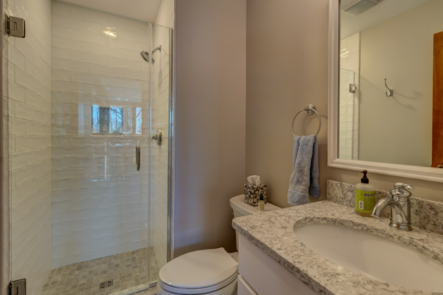 Custom tile work in bathroom remodel Chittenden County Vermont by Tradecraft VT