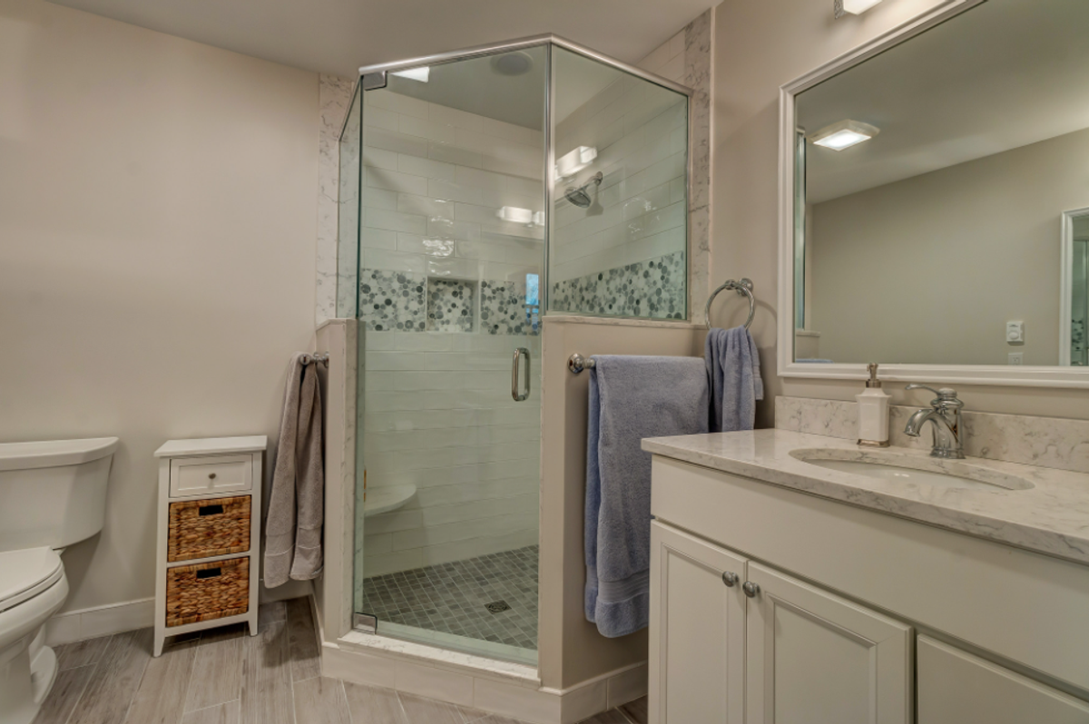Bathroom remodel with corner glass shower, Stratton Mountain Vermont by Tradecraft VT