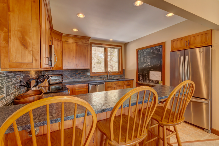 Rustic stone finish kitchen cabinetry handcrafted in Vermont by Tradecraft VT