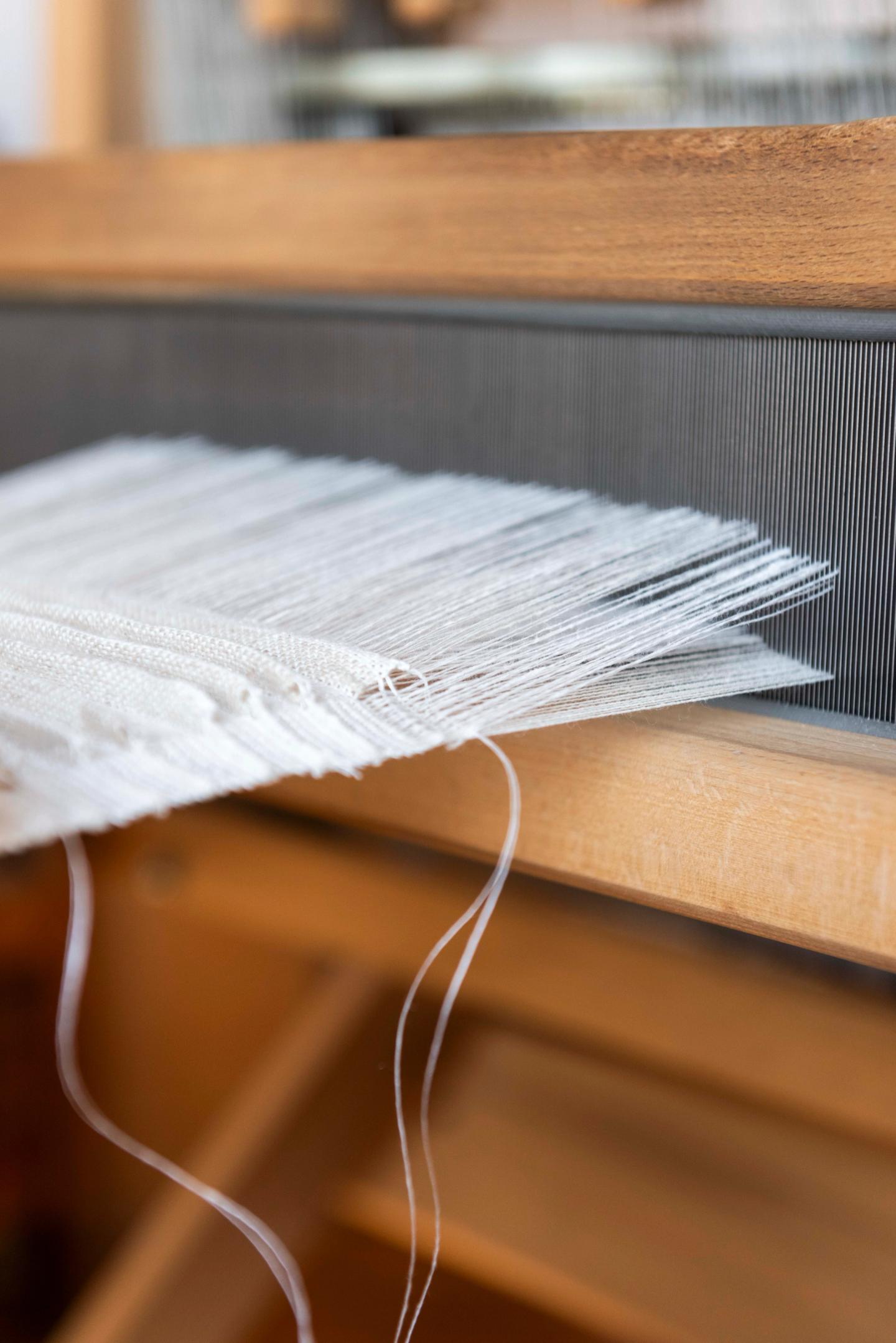 Pleated textile being woven on the loom