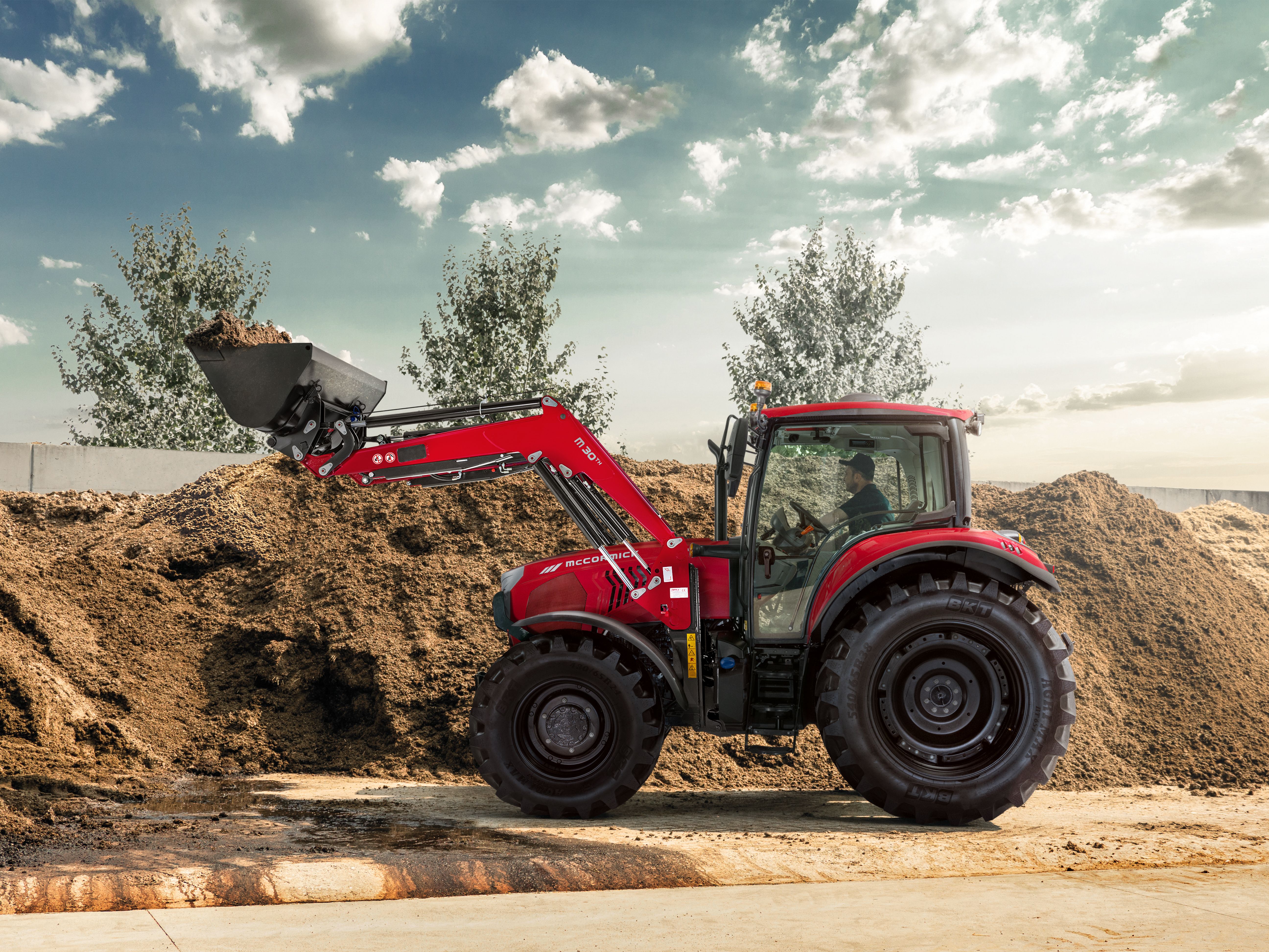 McCormick tractor working with a front loader