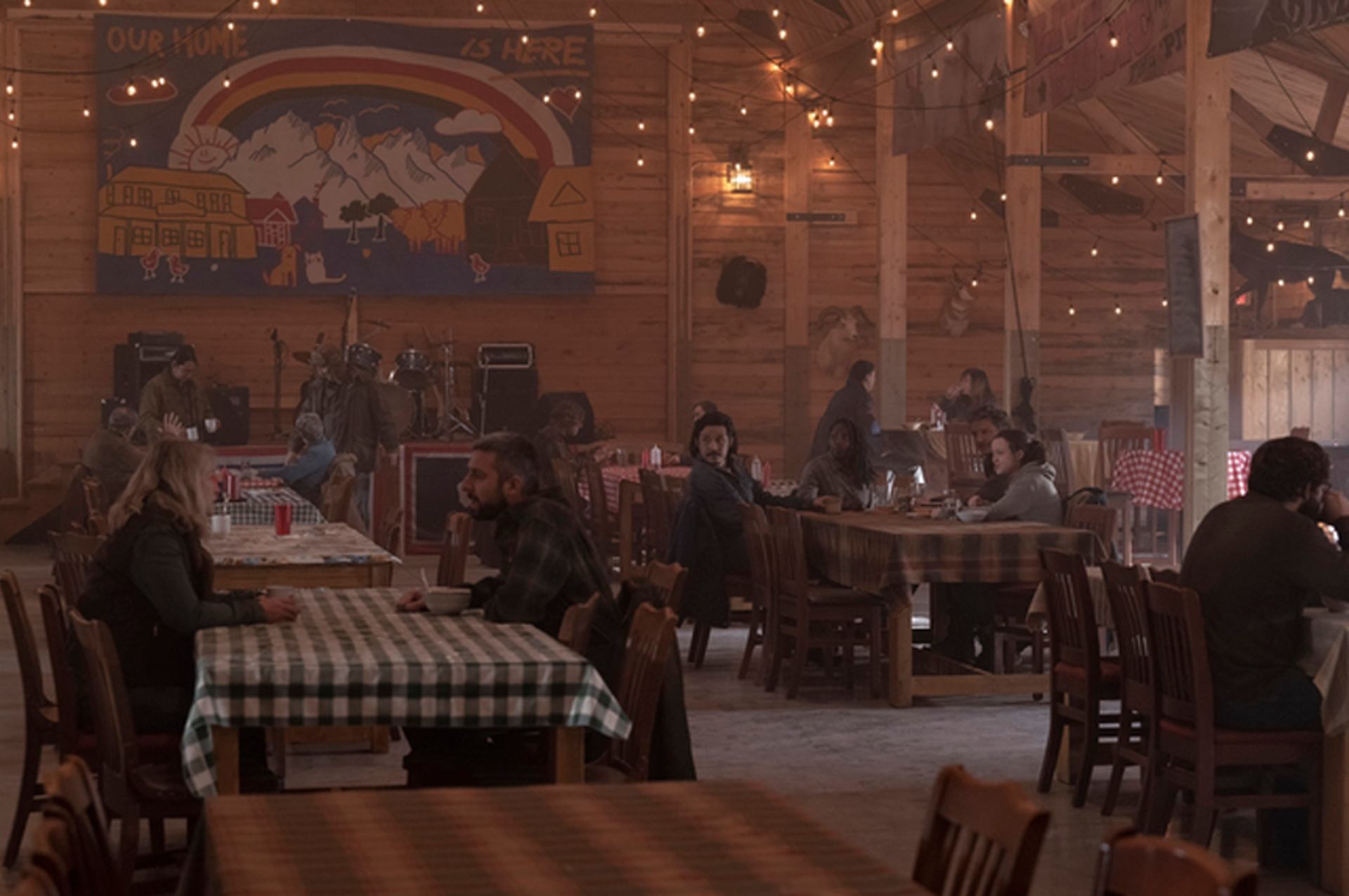 People sitting at tables in Willow Lane Barn in Olds