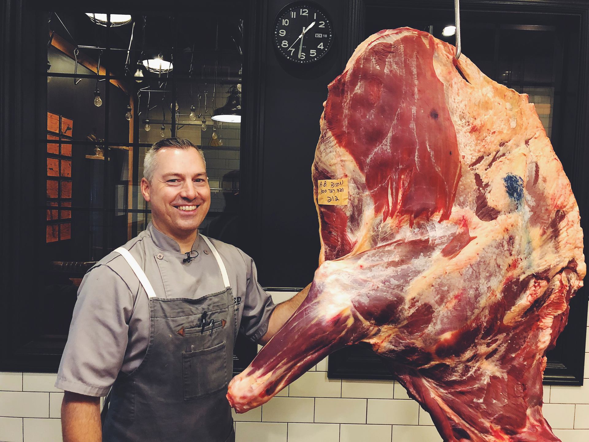 Blair Lebsack standing with a side of beef from RGE RD
