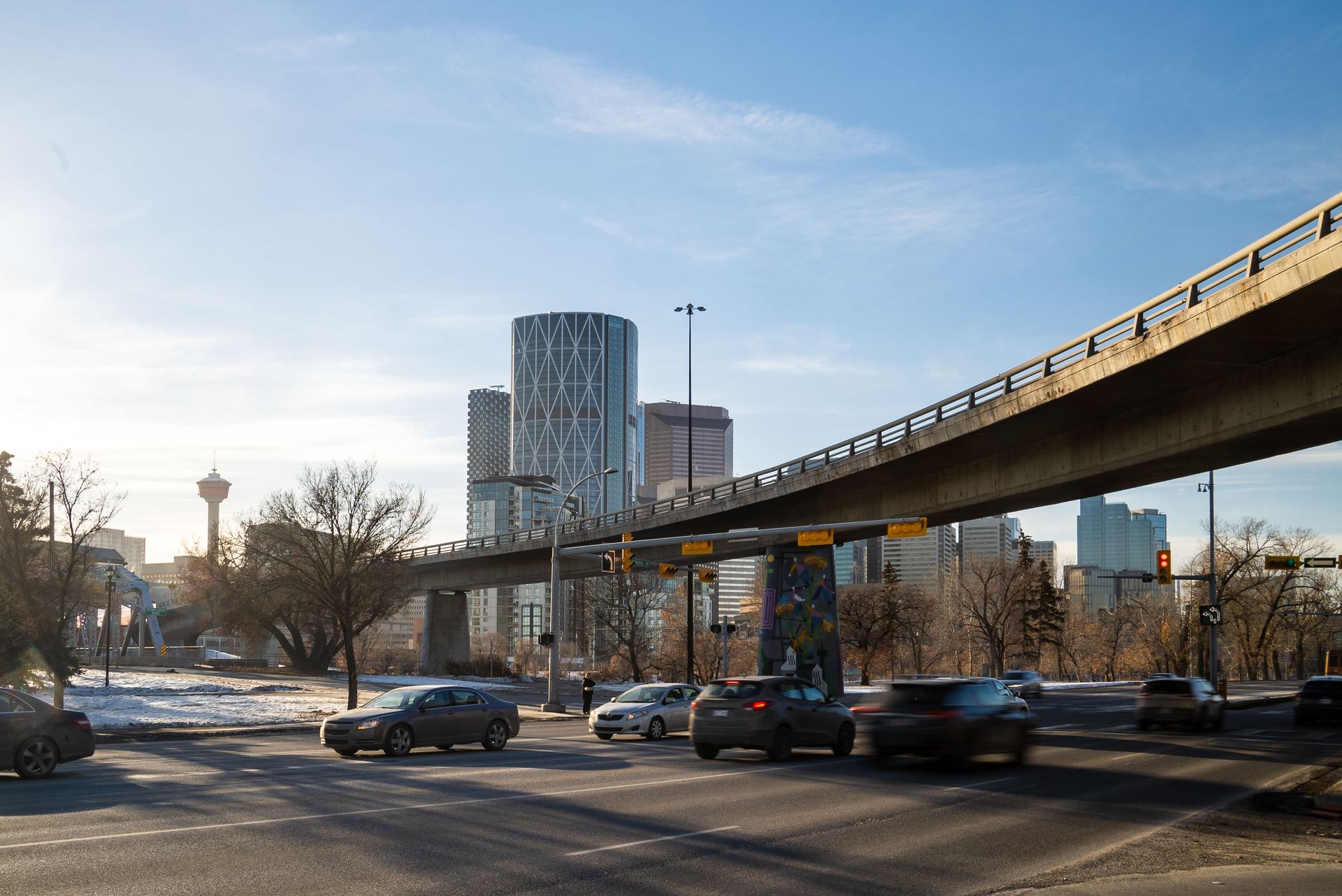 Cars passing under Calgary's 4th Avenue Flyover bridge.