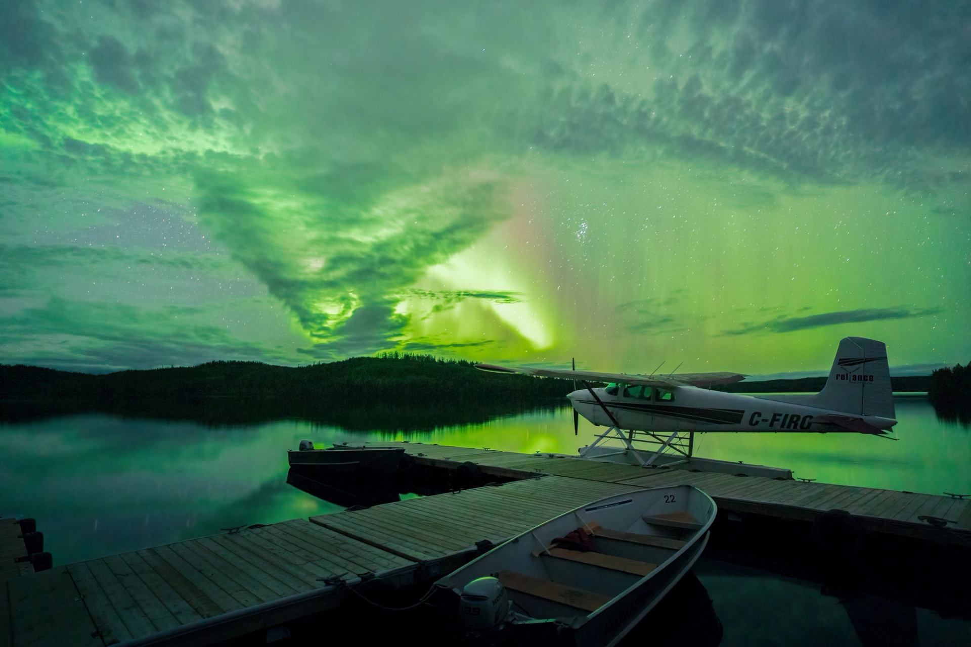 Northern lights above a float plane at Andrew Lake Lodge.