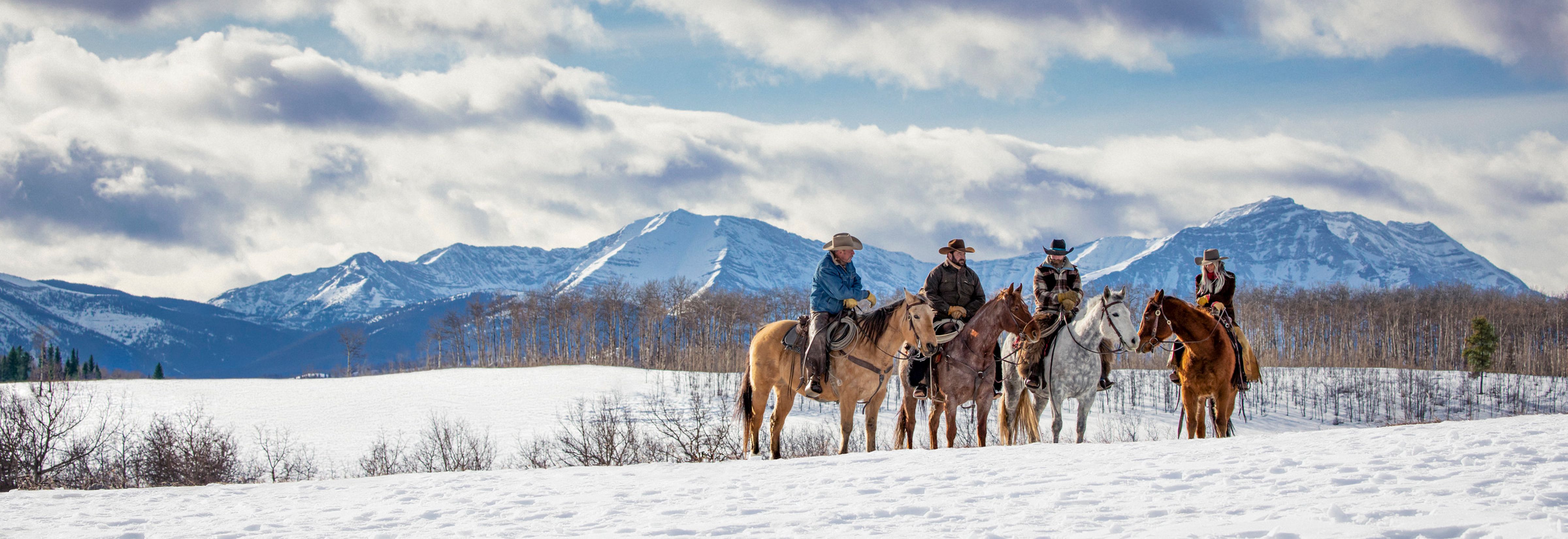 People horseback riding in winter