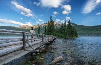 woman running across bridge pyramid lake jasper