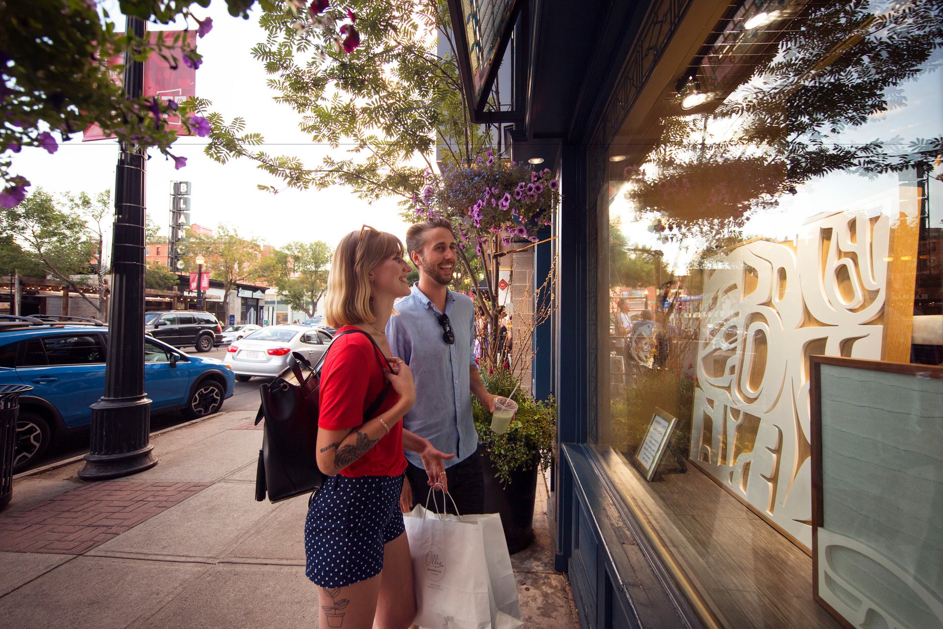 A couple shopping at an Indigenous art gallery in downtown Calgary on 17th Avenue.