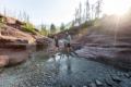 Couple crossing the stream at Red Rock Canyon.