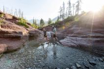 Couple crossing the stream at Red Rock Canyon.
