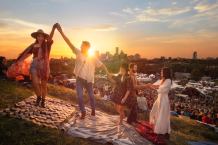 Friends dancing at dusk at the Edmonton Folk Festival