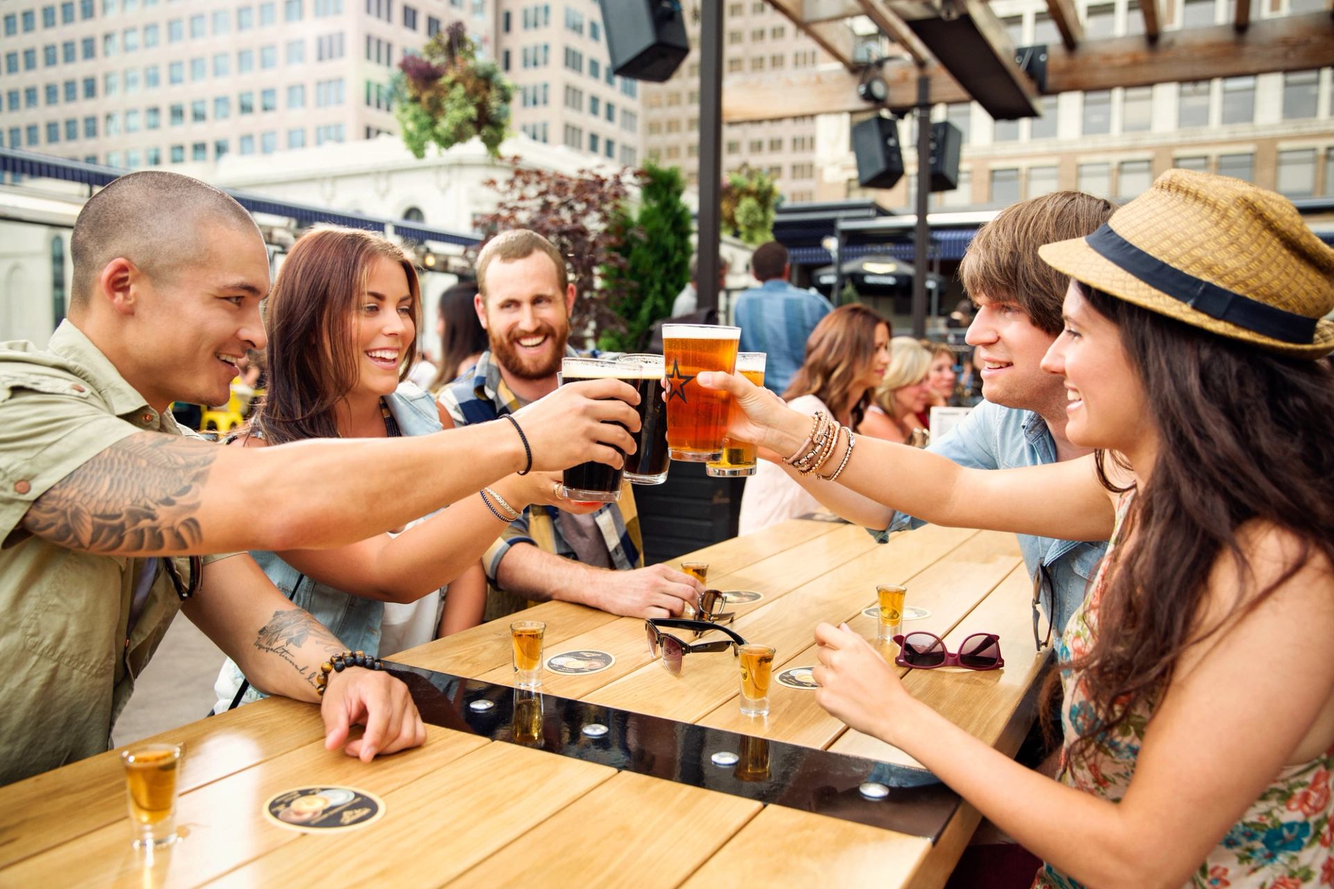 Group of friends having lunch on the rooftop patio at The National on 8th Avenue in Calgary.