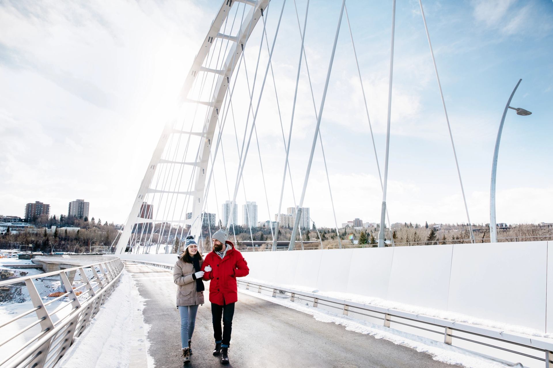 Couple walking along Walterdale Bridge.