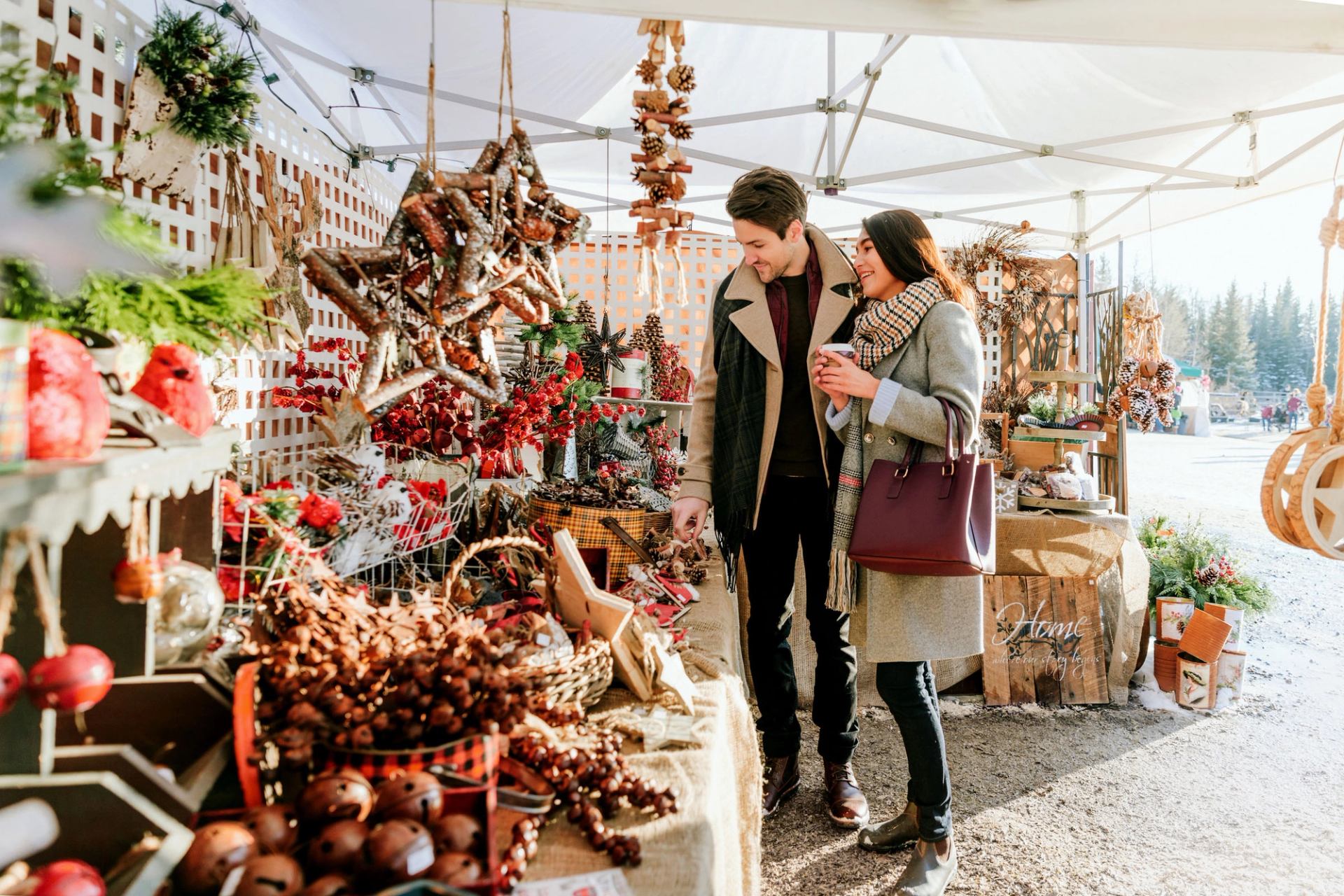 A couple shops a display of Christmas decorations at the Millarville Christmas Market.