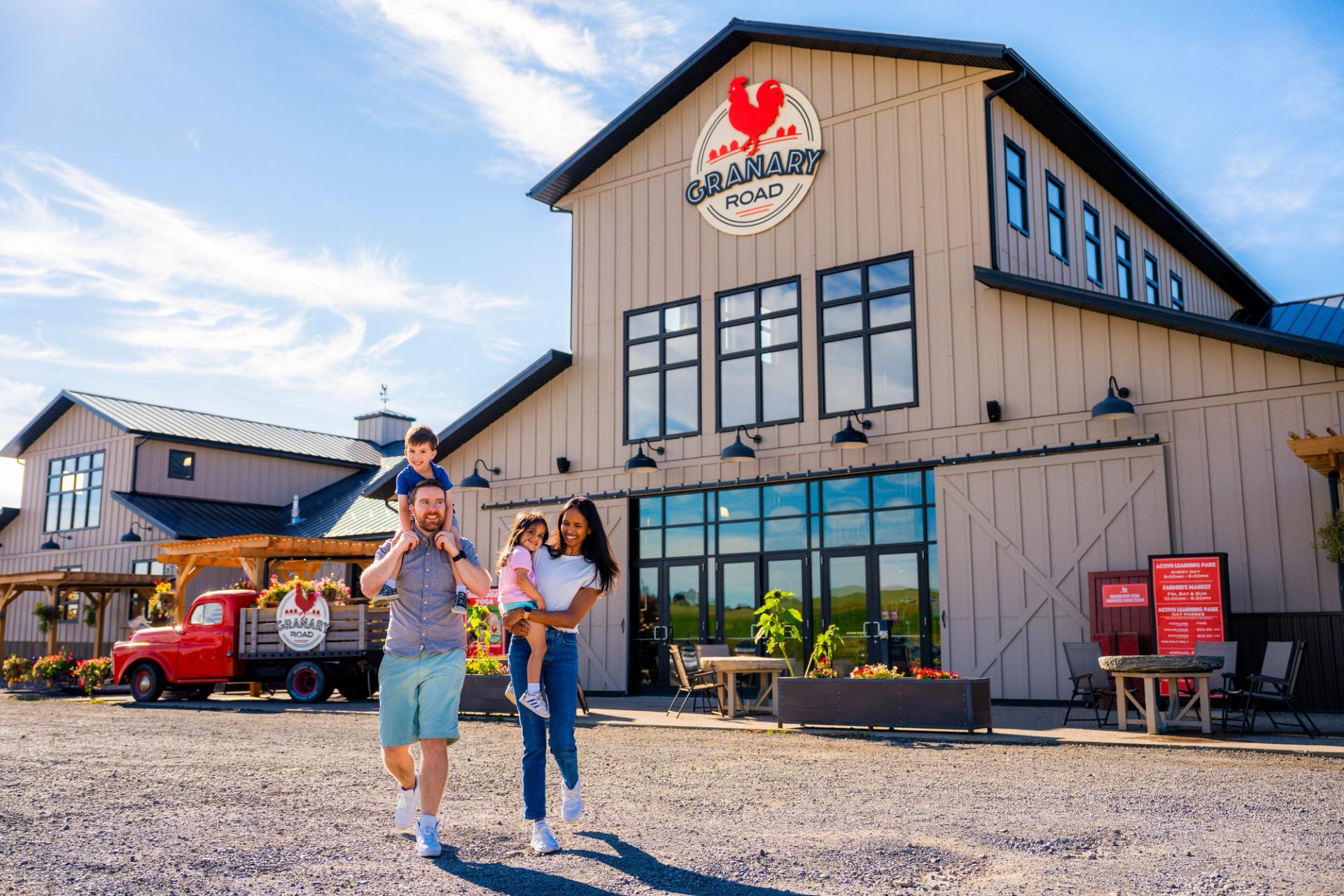Family walking away from the Granary Road Park, Farmyard & Farmer's Market