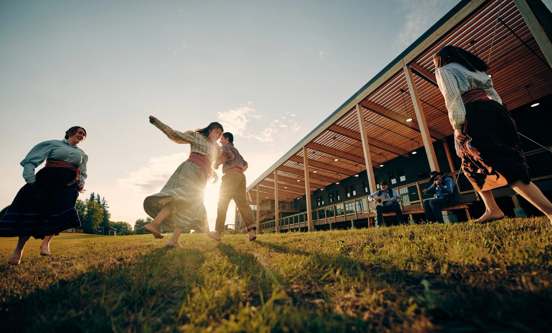 Métis interpreters doing the jigging dance at Métis Crossing.