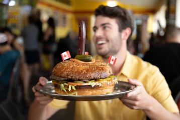 A man with a huge burger in Drumheller