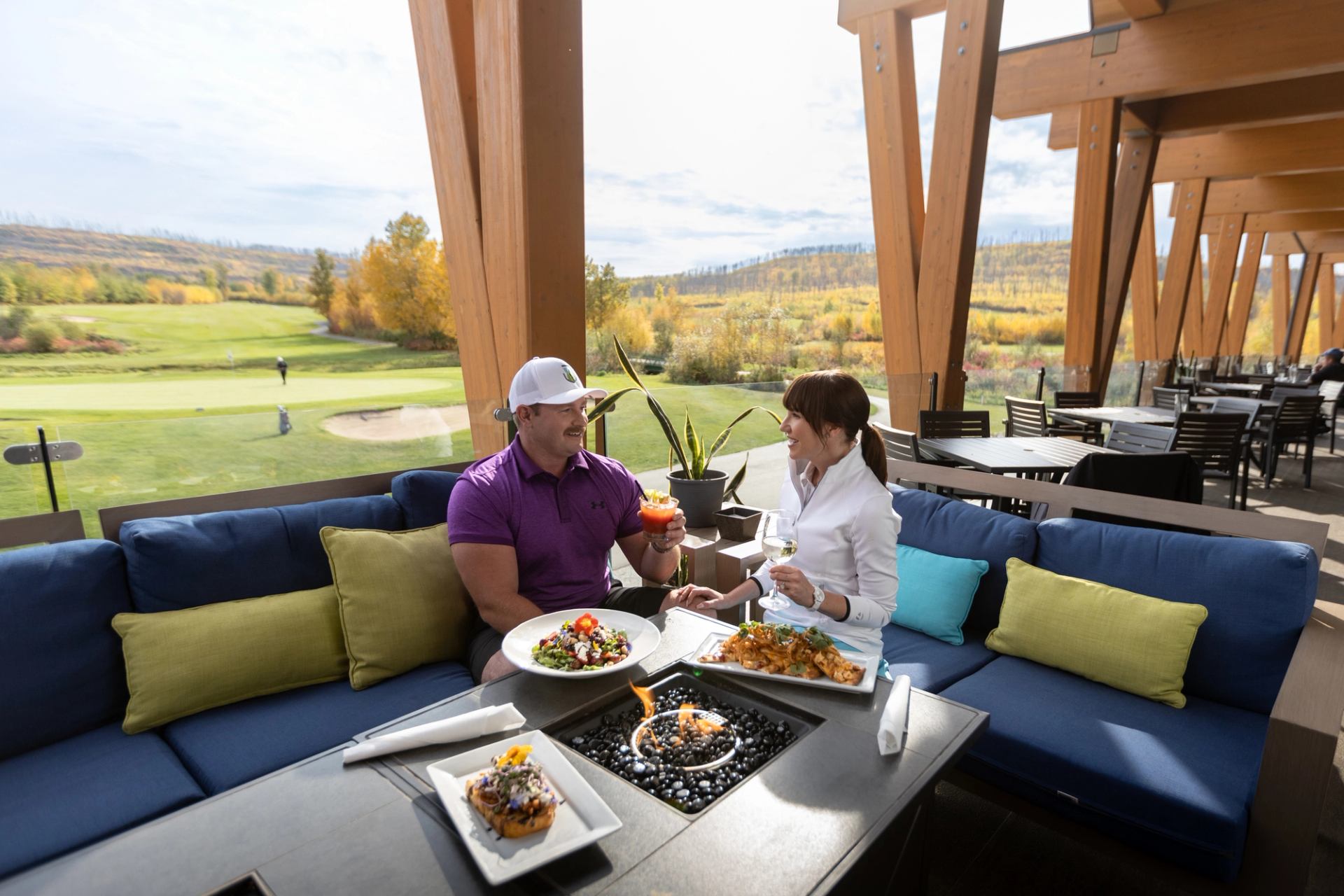 Two golfers having lunch at a clubhouse.