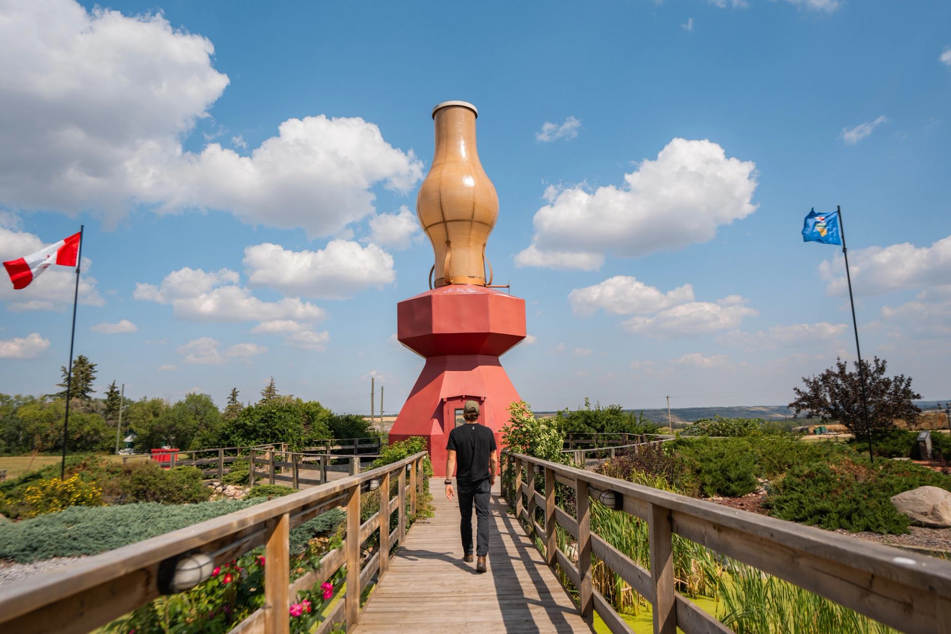Man walking up to World's Largest Lamp in Donalda