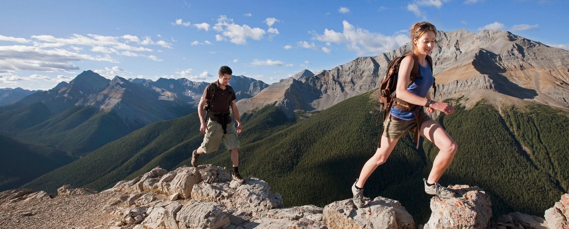 Couple hiking at the top of a mountain in Jasper National Park.