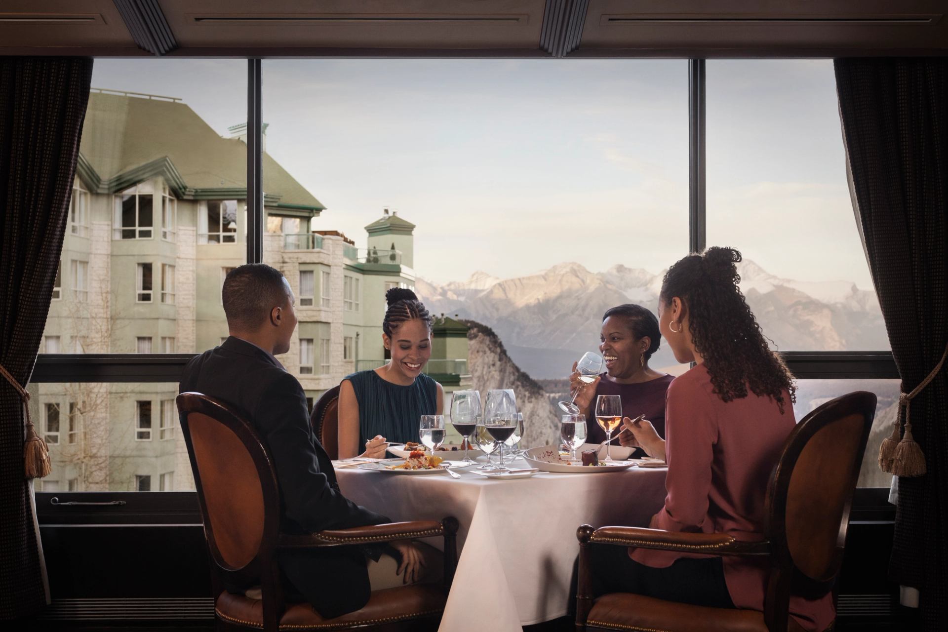 A group enjoy an elegant dinner with a view at Eden.