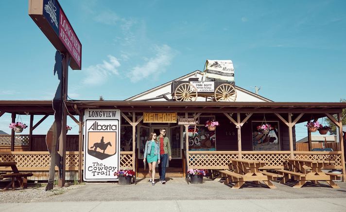 Couple walking out of the the Beef Jerky Store in Longview.